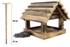 A wooden bird feeder with a stake and a pile of birdseed, with dimensions indicated. Podgląd zdjęcia produktu
