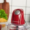 A close-up shot of a red Russell Hobbs mini chopper on a kitchen counter. Produktbild-Vorschau