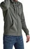 A man wearing a green zip-up hoodie and blue jeans. Produktbild-Vorschau