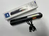 A black LED inspection lamp with a USB charging cable and its packaging box. Produktbild-Vorschau