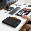 A desk setup with a laptop, monitor, keyboard, mouse, and a drawing tablet being used by a person. Náhled obrázku produktu