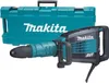 A Makita demolition hammer and its carrying case are displayed against a white background. Anteprima dell’immagine prodotto