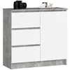 A modern white and gray cabinet with three drawers and a door, displayed against a white background. A camera is placed on top of the cabinet.