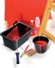 A painting setup with a bucket, paint, brushes, and a ladder. Anteprima dell’immagine prodotto