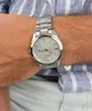 A close-up of a person's wrist wearing a silver Seiko watch. Náhľad obrázku produktu