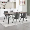 A dining set with four chairs around a table in a modern dining room. Produktbild-Vorschau