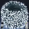 A bundle of white LED string lights coiled together, with a power adapter and a remote control visible. Produktbild-Vorschau