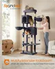 A woman interacting with a multi-level cat tree in a living room setting, with cats on the tree and a cardboard box nearby. Produktbild-Vorschau