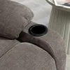 A close-up view of a recliner chair's armrest, featuring a built-in cup holder. Podgląd zdjęcia produktu