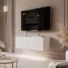 A modern living room with a wall-mounted TV and media console. Voir les images du produit