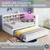 A white daybed with a pull-out trundle bed, featuring built-in shelving and LED lighting. Produktbild-Vorschau