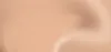 A close-up, abstract view of a liquid or creamy substance, likely foundation or makeup, with soft lighting and smooth gradients. Podgląd zdjęcia produktu