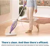 A person is using a steam mop on a wooden floor. Produktbild-Vorschau