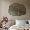 A bedroom scene with a mirror, bed, and decorative elements. Produktbild-Vorschau