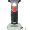 Close-up of the top part of a cordless impact wrench, showing the LED light and battery indicator. Produktbild-Vorschau