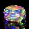 A coiled string of colorful LED lights against a black background. Produktbild-Vorschau