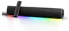 A black soundbar with RGB lighting and a remote control. Náhled obrázku produktu