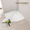 A white shower tray in a bathroom corner, with a circular inset showing a hand using a tool on a wall. Anteprima dell’immagine prodotto
