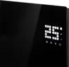 A close-up of a black electric heater with a digital display showing '25'. Voir les images du produit