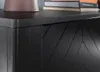 Close-up of the textured black wood of a cabinet door. Produktbild-Vorschau