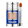 A product shot of a foundation stick and applicator brush against a white background. Podgląd zdjęcia produktu
