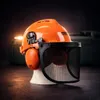 A safety helmet with ear protection and a face shield, displayed on a stand. Produktbild-Vorschau