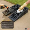 Hands cleaning a set of vehicle ramps outdoors, with water and a brush. Náhled obrázku produktu