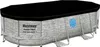 An oval swimming pool with a black cover, shown from a side angle on a white background. Produktbild-Vorschau