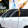 A collage showing different aspects of a portable camping shower, including its power source, water container, and use in washing a car. Voir les images du produit