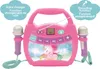 A pink karaoke machine with two microphones, featuring a unicorn graphic and control buttons. Produktbild-Vorschau