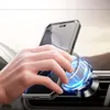 A hand is holding a smartphone with a protective case, attaching it to a magnetic car mount. Produktbild-Vorschau