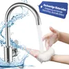 A person washing their hands under a modern kitchen faucet with water splashing. Produktbild-Vorschau