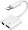 A white adapter with a lightning connector and two ports. Náhľad obrázku produktu