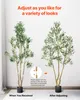 Two artificial olive trees are shown side-by-side, demonstrating how to adjust their branches for a desired look. The left tree is shown as received, and the right tree is shown after adjustment. An inset diagram illustrates the adjustment process. Anteprima dell’immagine prodotto