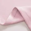 A close-up view of folded pink fabric, likely a curtain, showing stitching and the texture of the material. Produktbild-Vorschau