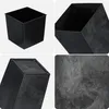 A collage of four images showing a black planter from different angles, including a close-up of its textured surface. Produktbild-Vorschau