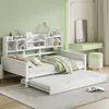 A white daybed with a pull-out trundle bed is shown in a bedroom with light green walls and a green vanity table. Náhled obrázku produktu