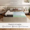 A cutaway view of a mattress showing its different layers, placed on a bed in a bedroom setting. Produktbild-Vorschau
