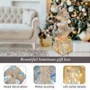 A decorated living room with a sofa and a Christmas tree, featuring a luminous gift box. Produktbild-Vorschau