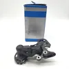 A bicycle derailleur and its packaging are shown against a white background. Náhľad obrázku produktu