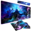 A large gaming mousepad with an RGB LED light strip along the edge, featuring a colorful, abstract cloud pattern. A smaller, rolled-up version of the mousepad is shown in the background. Produktbild-Vorschau