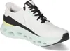 A white athletic shoe with black and yellow accents and a mint green sole. Voir les images du produit