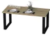 A dining table set with plates, cutlery, and a vase with greenery. Produktbild-Vorschau