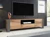 A modern living room with a TV stand and a large television mounted on a textured wall. Náhled obrázku produktu