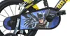 Close-up of the chain guard and pedals of a children's bicycle with a Batman theme. Náhľad obrázku produktu
