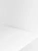 A white product stand is shown from a low angle, with the top surface receding into the background. Anteprima dell’immagine prodotto