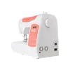 A white and orange sewing machine is shown from a diagonal side view against a white background. Anteprima dell’immagine prodotto