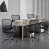 An office setting with multiple ergonomic office chairs arranged around a desk. Produktbild-Vorschau