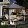 An outdoor patio scene at dusk featuring a gray gazebo with furniture and lighting. Náhled obrázku produktu