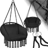 Two black macrame hanging chairs with cushions and fringe details are displayed against a white background. A pair of metal rings with braided ropes are in the foreground. Náhled obrázku produktu